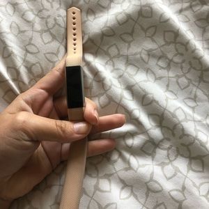 Fitbit Alta with small light pink band